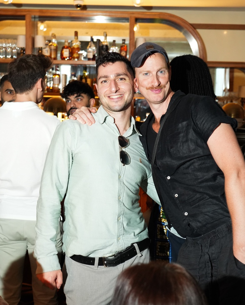 Maslow’s members smiling and socialising at a vibrant evening event—capturing the warmth, diversity, and connection that define the brand’s thriving member community.