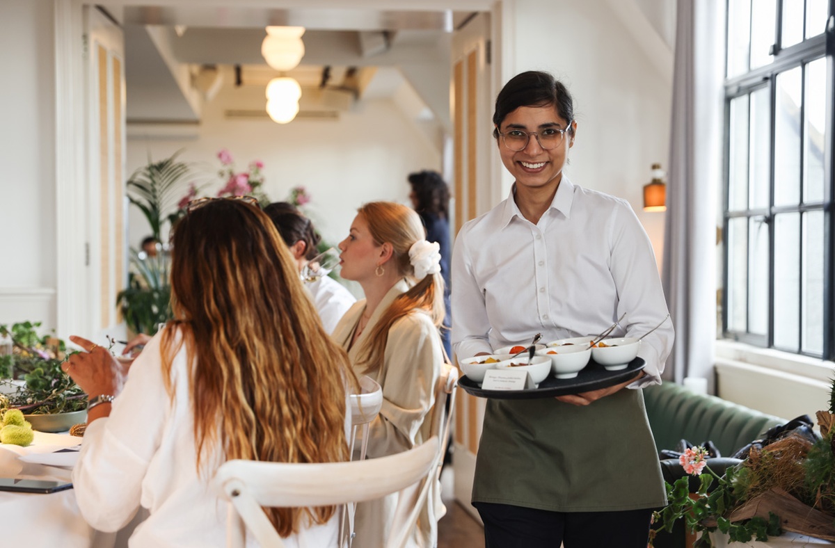 Host Serving Canapes in Loft & Gallery at Mortimer House, Fitzrovia Event Space