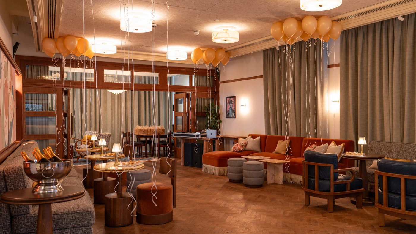 Library & Drawing Room at 1 Warwick in Soho, London, decorated with balloons, champagne, and seating for a festive private party.