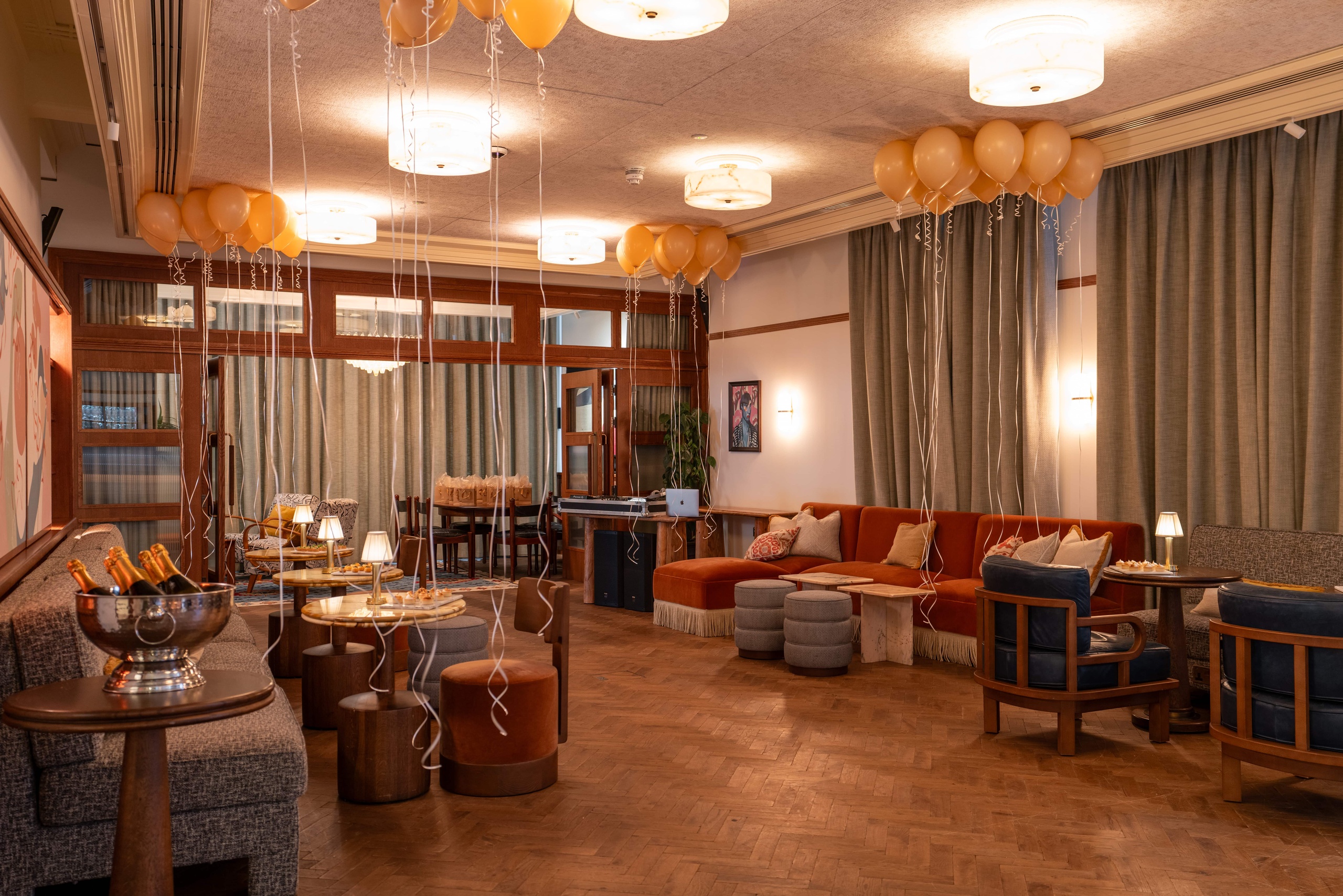 Library & Drawing Room at 1 Warwick in Soho, London, decorated with balloons, champagne, and seating for a festive private party.