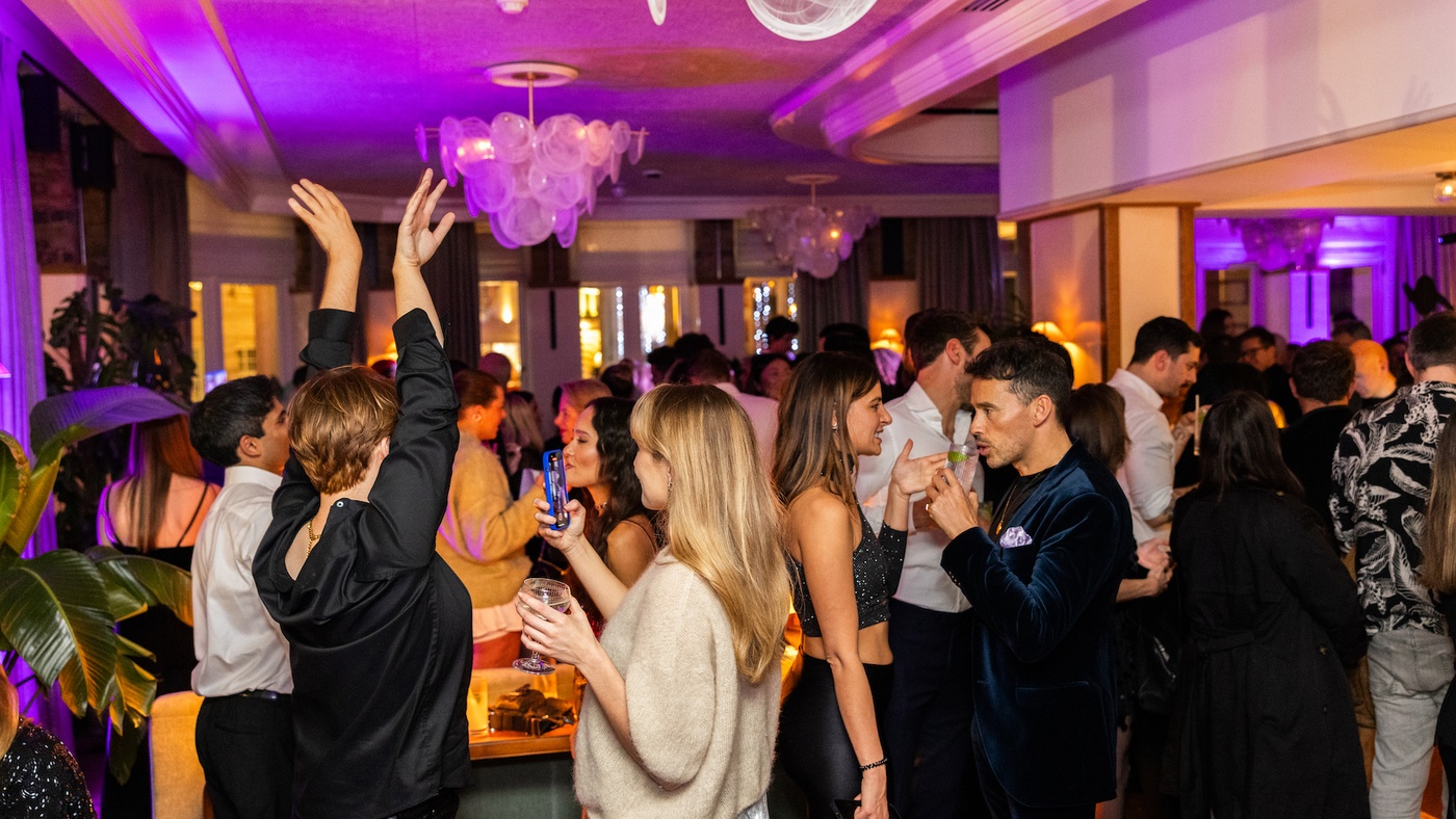 Christmas Party Scene with Guests Mingling in the Living Room at 1 Warwick Soho