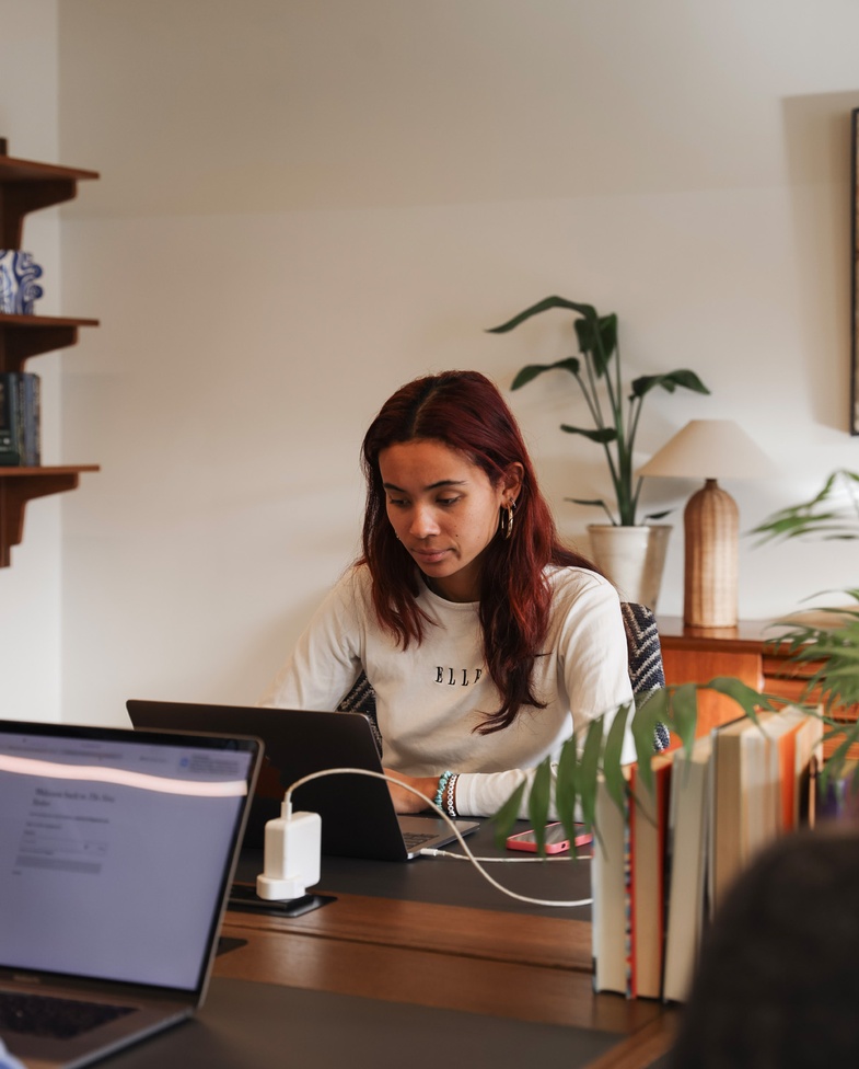Woman working at private study desk