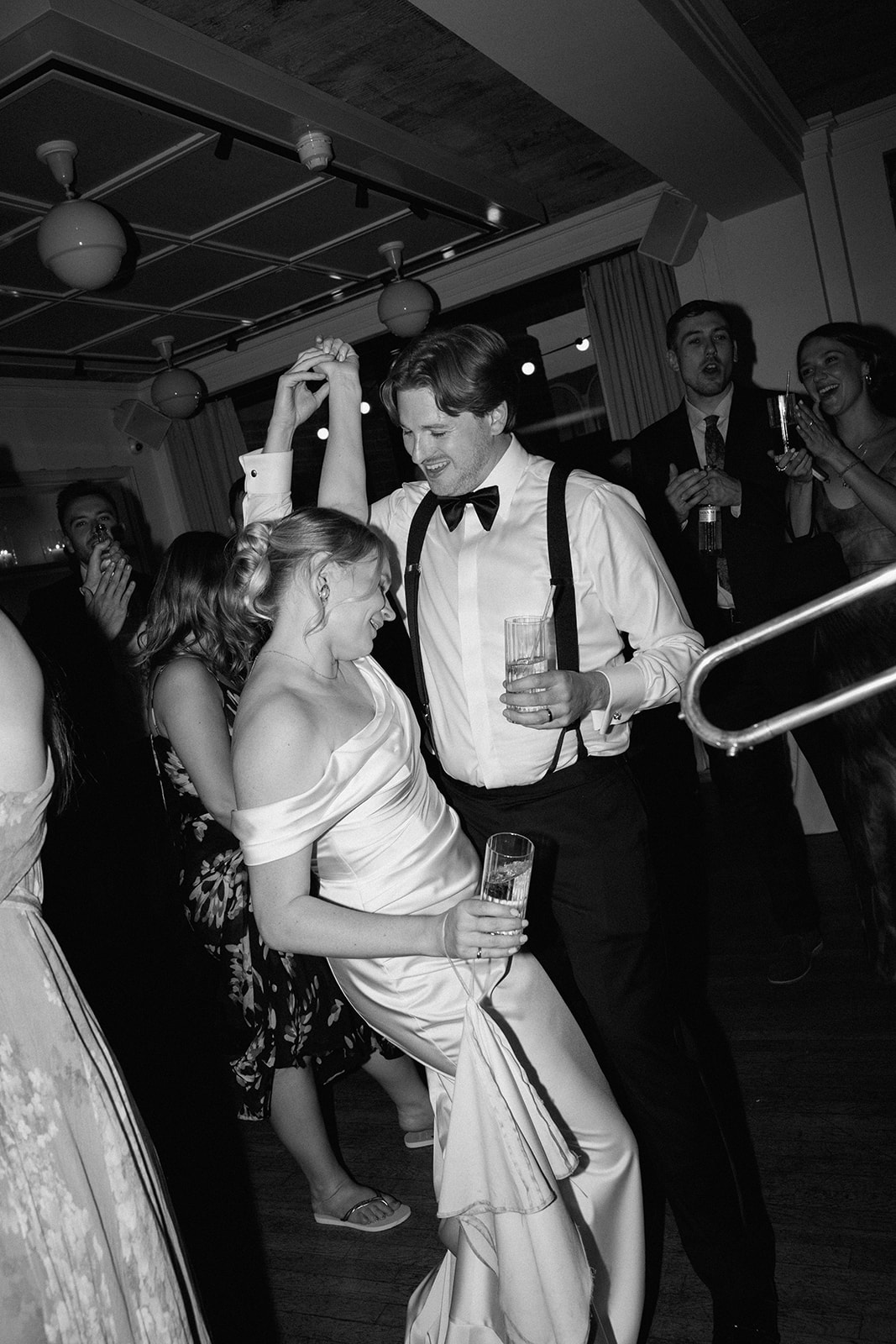 Photography by Danielle Victoria | Newlyweds dancing with guests during an intimate wedding reception at a stylish Fitzrovia wedding venue in central London.