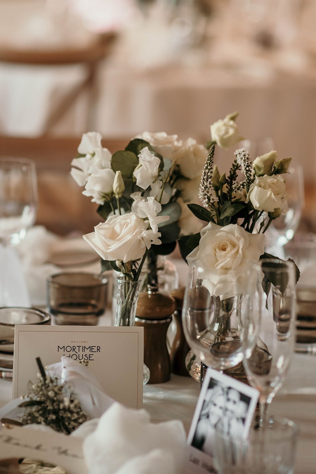 Photography by Alba Turnbull | Elegant wedding reception table with white floral centrepieces, glassware and place settings at an intimate wedding venue in Fitzrovia, London.